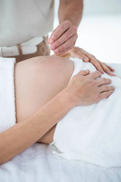 Prenatal treatment session for an expecting client